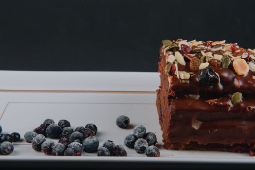 Chocolate cake with raisins lies on the table