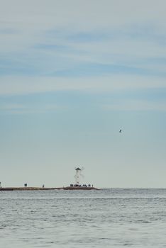 Old lighthouse in Swinoujscie, a port in Poland on the Baltic Sea. The lighthouse was designed as a traditional windmill. Panoramic image