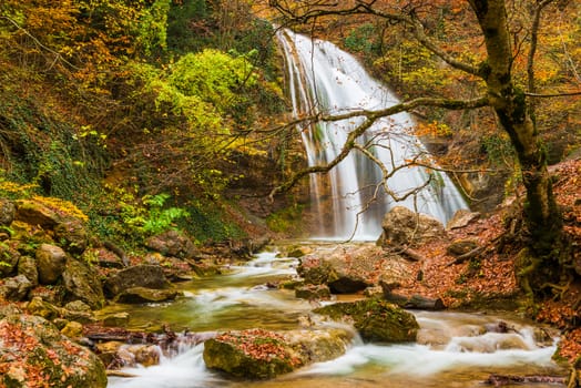 Landmark of the Crimea peninsula, Russia waterfall Jur-Jur in the fall, a beautiful landscape.