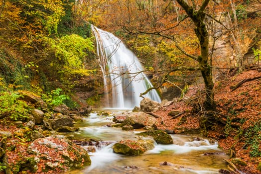 Waterfall Jur-Jur in the mountains in autumn, natural sights of the Crimea peninsula, Russia