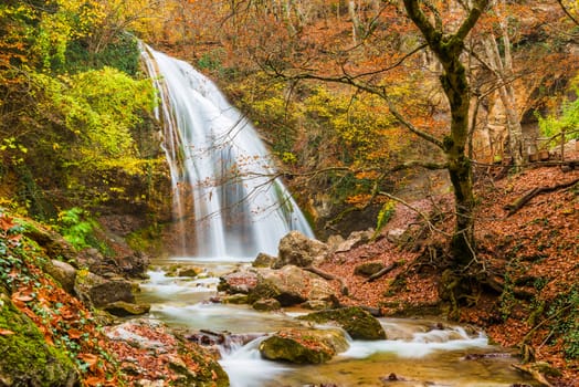 Horizontal photo of Jur-Jur waterfall in the mountains in autumn, natural sights of the Crimea peninsula, Russia