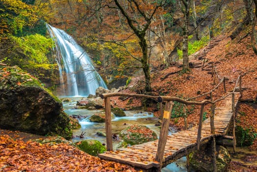 Postcard view of the waterfall Jur-Jur in the autumn season, the nature of the Crimea, Russia