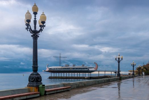 Walk along the embankment of the resort Yalta in the autumn afternoon, Crimea, Russia