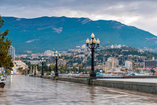 Beautiful embankment of the resort of Yalta on an autumn rainy day, the peninsula of Crimea, Russia