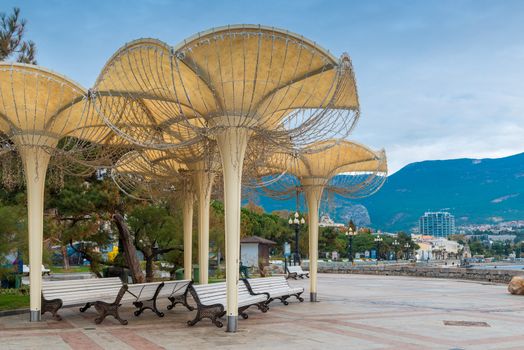 Business card of the city of Yalta of the Crimea peninsula - umbrellas on the embankment, Russia