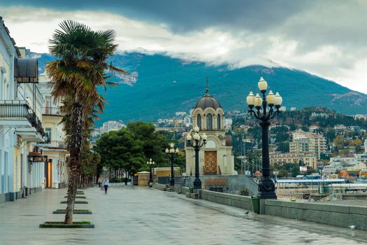 Autumn walk along the empty embankment of the city of Yalta, Russia, Crimea peninsula