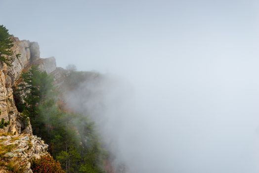 Clouds high in the mountains, mountain peaks coming out of the clouds