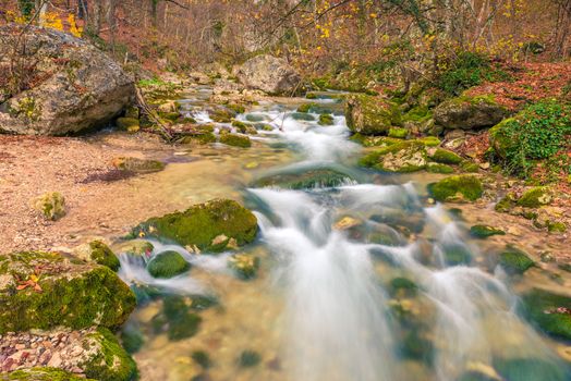 Photo of autumn in the mountains landscape of the river and stones in the canyon