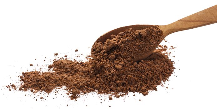 Cacao. Pile cocoa powder in spoon isolated on white background with clipping path