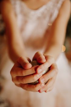 A child holding Christmas ball. Christmas vertical card design. Copy space. Close-up