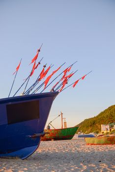 fisherman boats at sunrise time on the beach in summer
