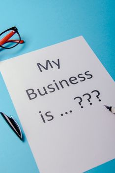 My business is word concept. Business word with business document paper on blue background. For business concept ideas background.