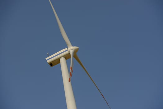wind trubine at sunny day with blue sky