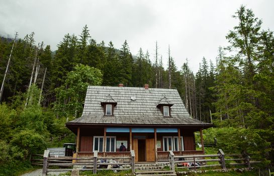 old wooden hut cabin in mountain at rural summer landscape