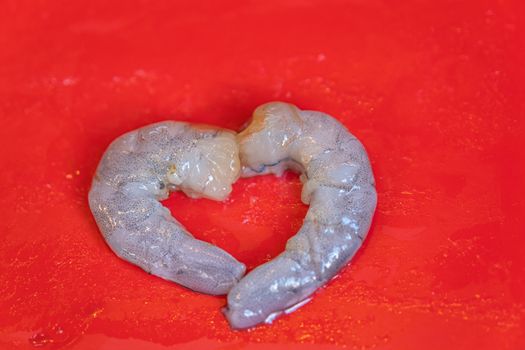 The couple Fresh Shrimp in red plate background for cook