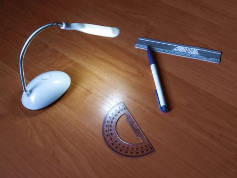Table lamp and stationery, lamp, ruler and pen