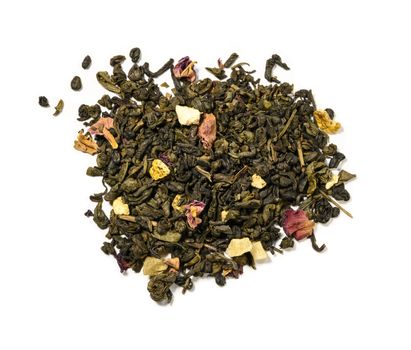 Green tea with aromatic additives. Top view on white background.