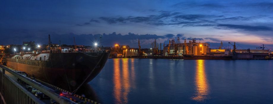 Panoramic view of the sea port and cargo terminal in Odessa, Ukraine, at the summer night