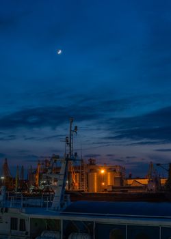 Panoramic view of the sea port and cargo terminal in Odessa, Ukraine, at the summer night