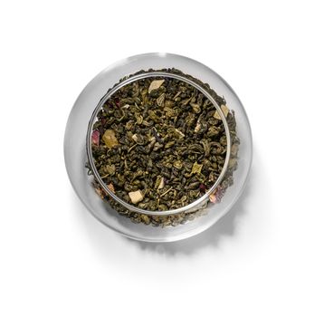 Green tea with aromatic additives. Top view on white background.