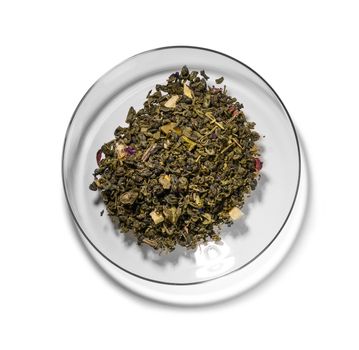 Green tea with aromatic additives. Top view on white background.