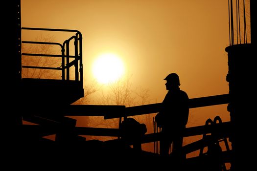 men at work in incredible sunset