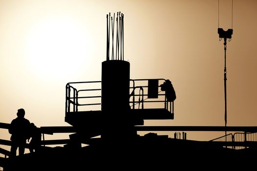 men at work in incredible sunset