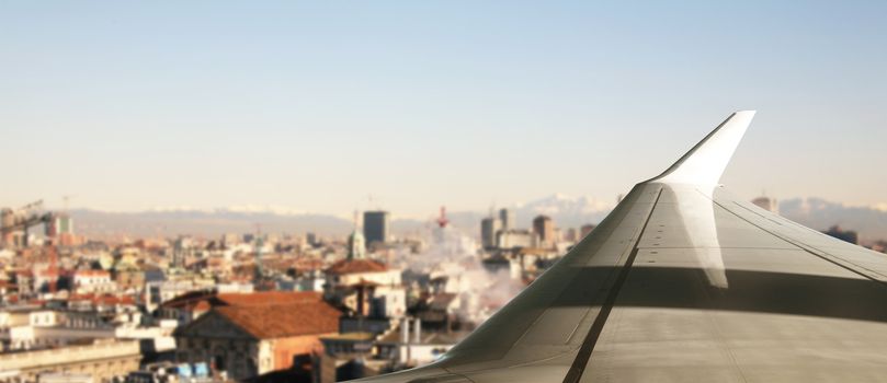 a Plane flying over a city