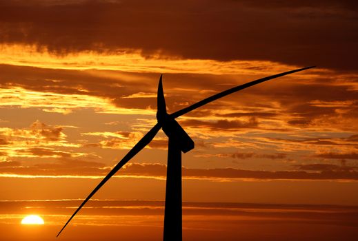 wind turbine on sunset background