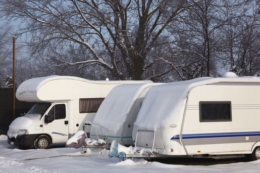 motorhome and caravan at winter with snow
