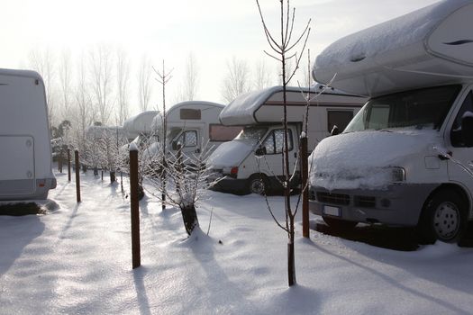 motorhome and caravan at winter with snow