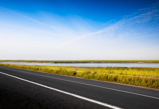 a fantastic desert road with blue sky