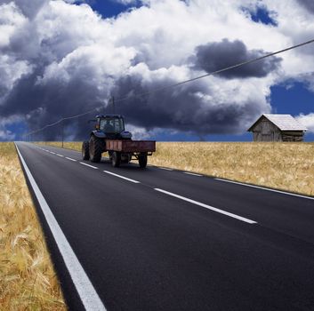 a country road with tractor