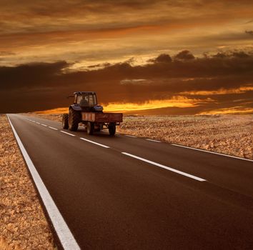 a country road with tractor