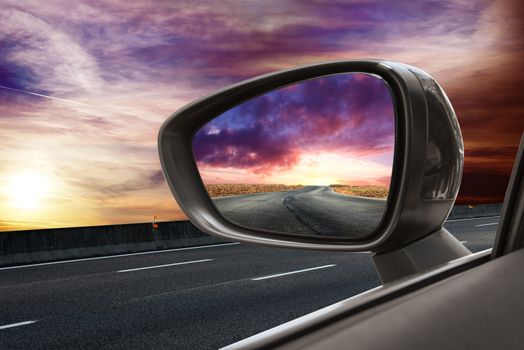 Reflected road in rearview mirror