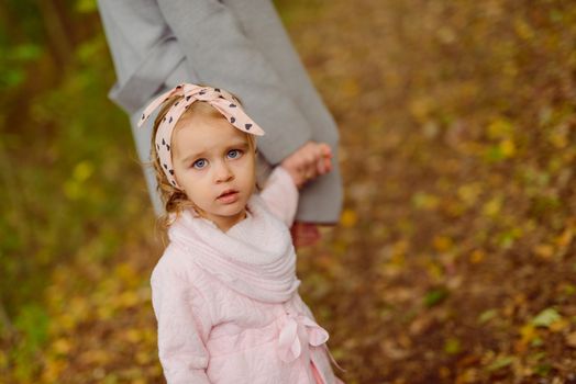 beautiful little girl smiling on a sunny day. Blue eyes. head shot.