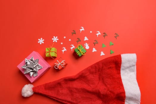 Christmas or New Year background, plain composition made of Xmas decorations and fir branches, flat lay, blank space for a greeting text.