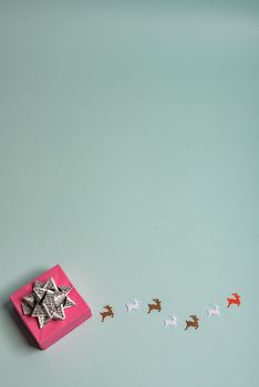 christmas presents nicely decorated with bows and feathers. view from above