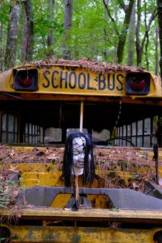Halloween Mask on Old School Bus at  junkyard