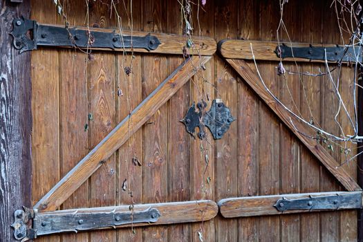 An element of the architecture of an old wooden house made of logs. Vintage style, eco-friendly residential building.