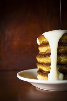 Fresh hot pancakes on a white ceramic plate