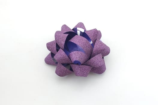 
Purple lush bow isolated over white background