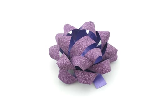 
Purple lush bow isolated over white background