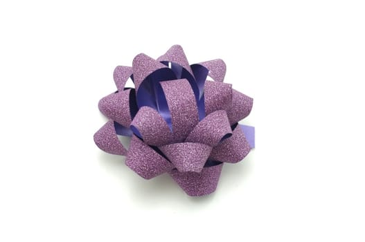 
Purple lush bow isolated over white background
