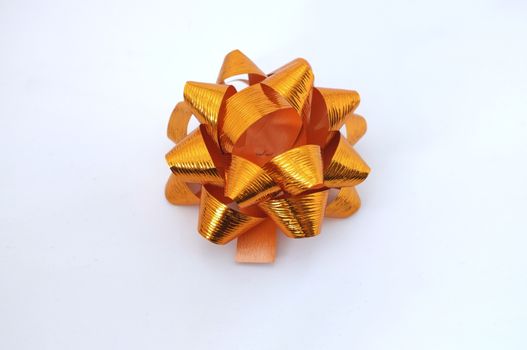 Orange lush bow isolated over white background 