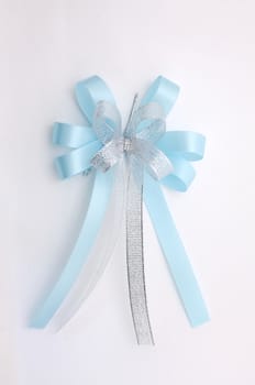 Blue lush bow isolated over white background