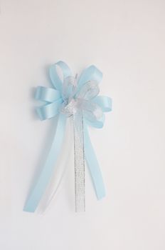 Blue lush bow isolated over white background