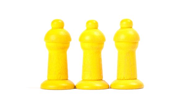 Wooden pawns of a leisure game, isolated on white