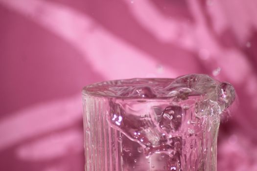 clear water drops pink background