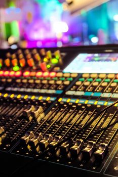 Closeup of an audio mixing control panel